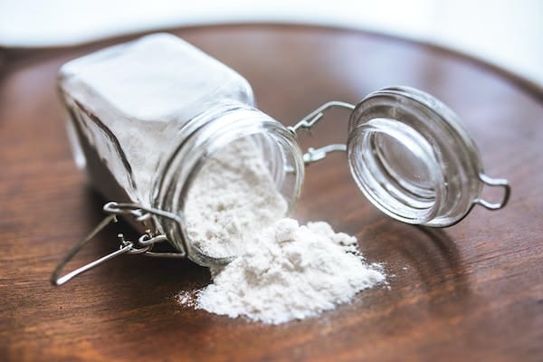 A spilled baking soda from a glass jar