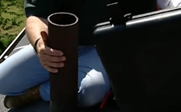 A person holding a big pipe