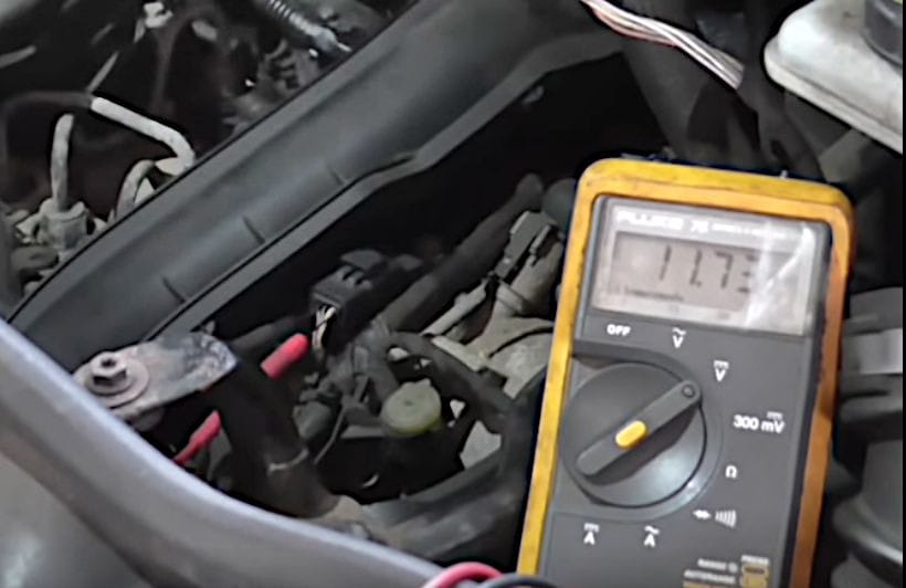 An acceptable Hall effect sensor voltage reading on a multimeter at 11.73