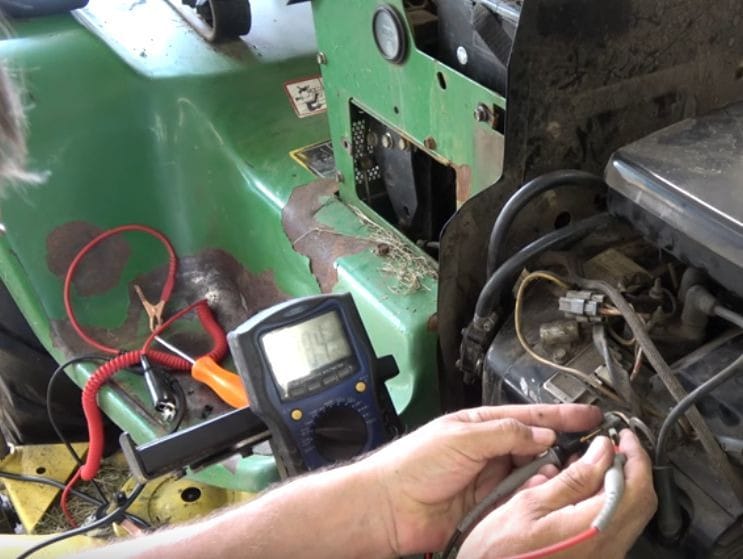 A person connecting the multimeter's probes for the continuity test