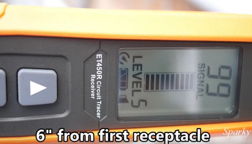 An LCD screen of a wire tracer tool displaying Signal 99 and Level 5 in it