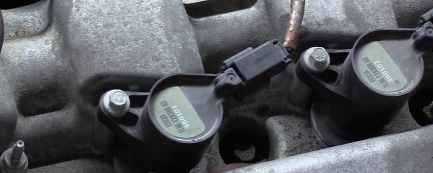 A close up look of a car engine's coil packs