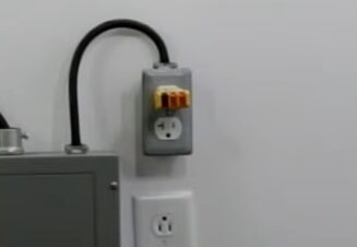 A wall outlet with a plug attached to it