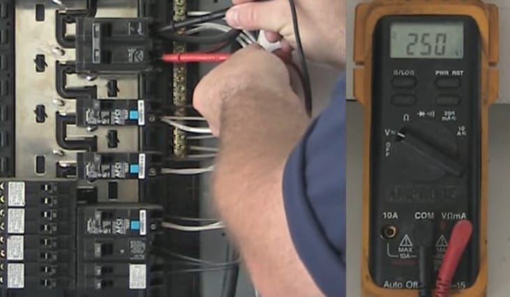 A 250 reading on the multimeter as the man testing the circuit breaker in a main panel