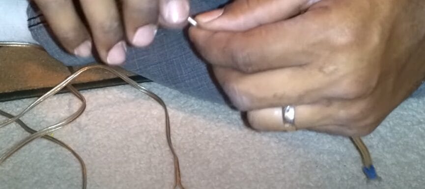 A person is connecting wires