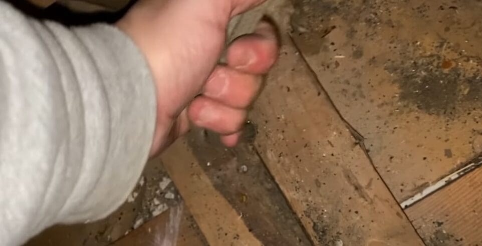 A person removing wires