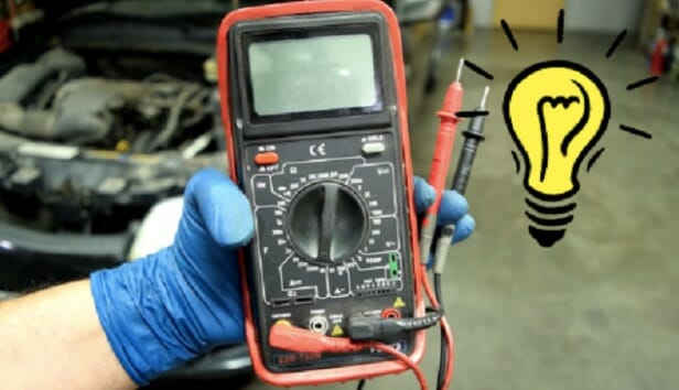 technician holding a multimeter 1