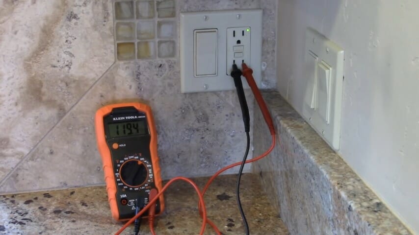 multimeter testing the outlet