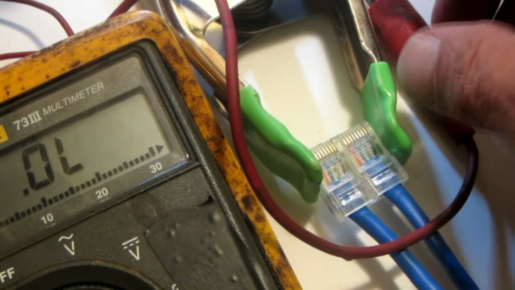 clipper on ethernet cable and multimeter at OL reading