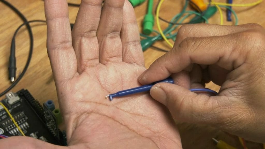 hook probes in a man's palm