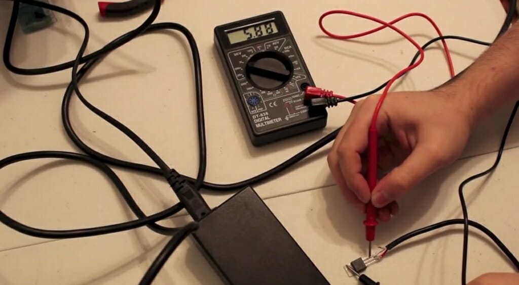 testing the regulator with multimeter at a reading 5.88v