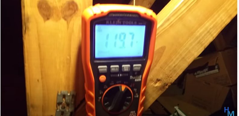 multimeter with reading of 119.7