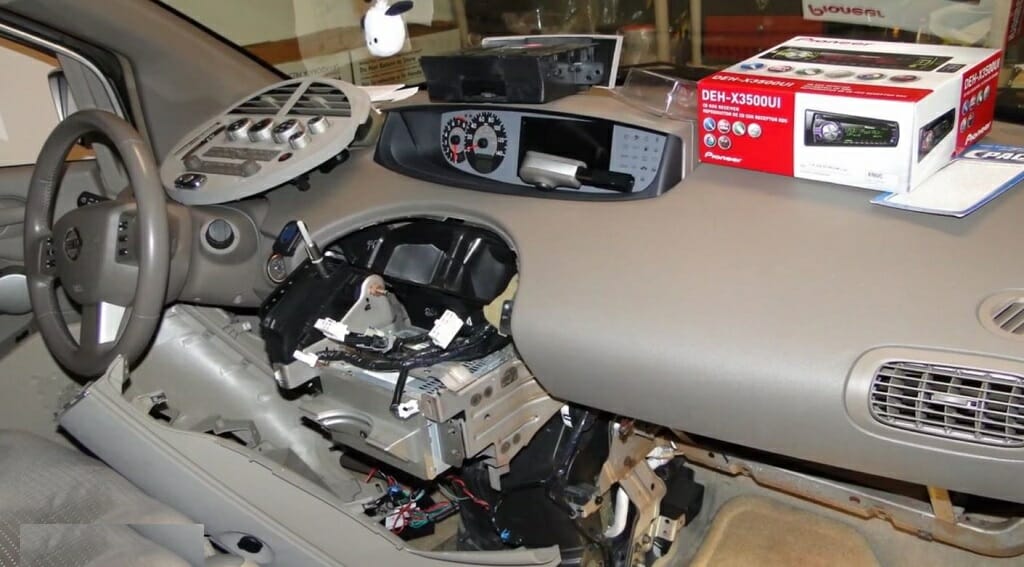car with dismantled speaker section