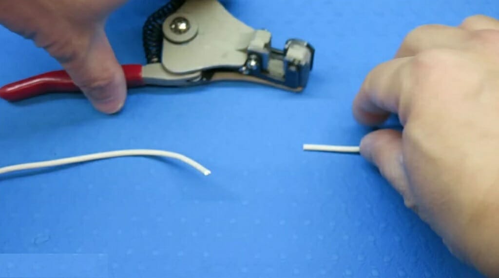 cut white wires with wire cutter