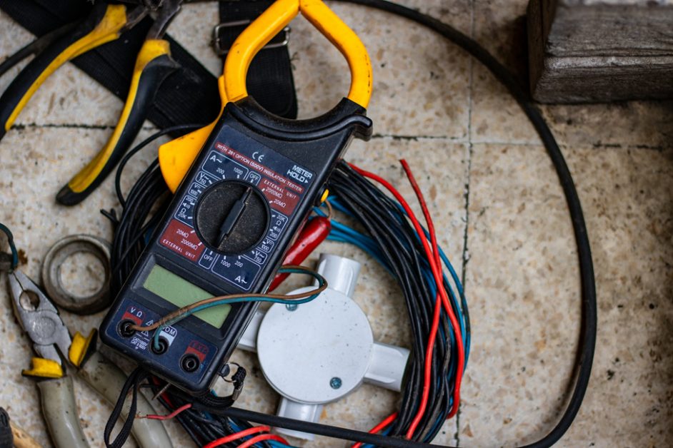 multimeter with wires and different kind of tools