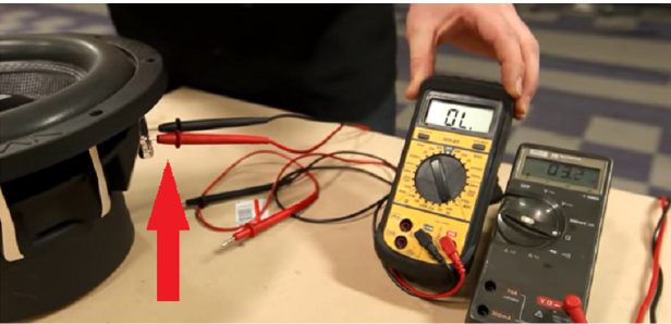speaker at the table with 2 multimeters