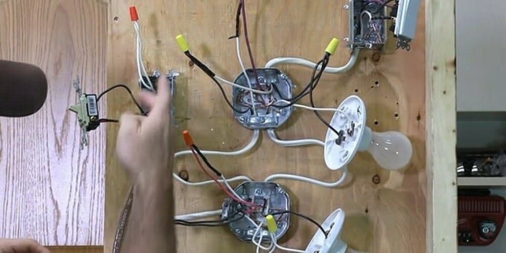 man wiring multiple lights