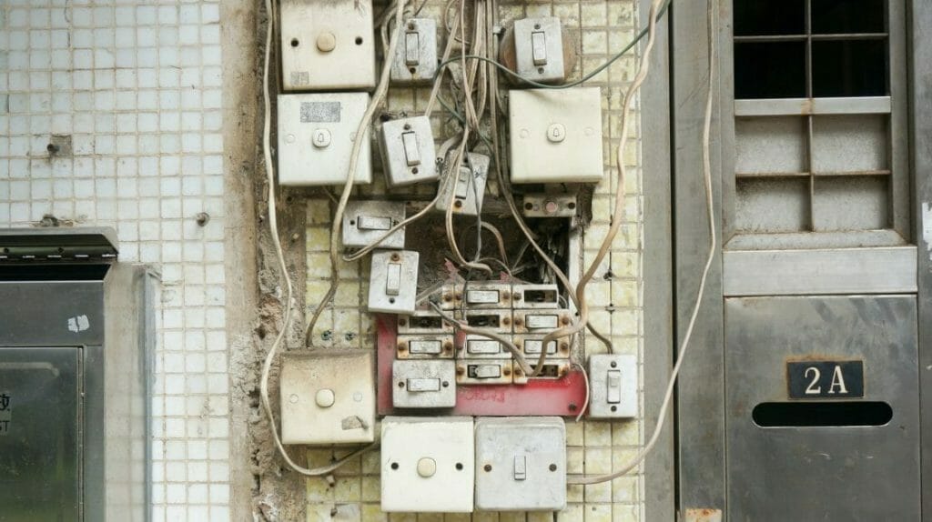 assorted power switches mounted on white wall
