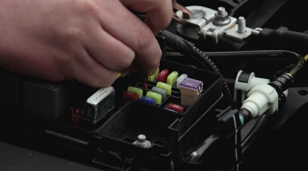 connecting the wire that comes from the positive battery terminal