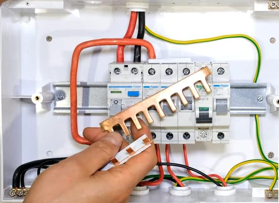 connecting wires to the circuit breaker and the bus bar