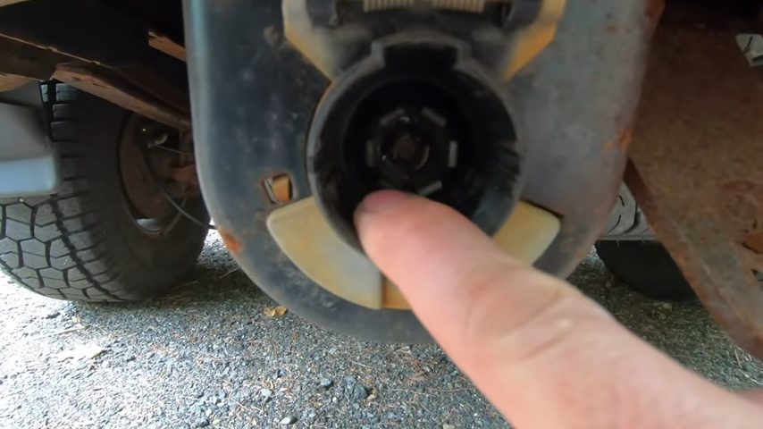 detaching cables that connect the car to a trailer winch