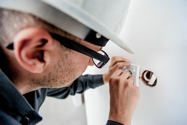 electrician examining wires