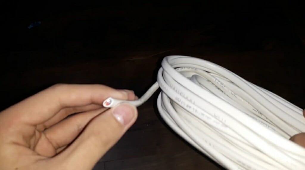 hand holding an 18-gauge wire