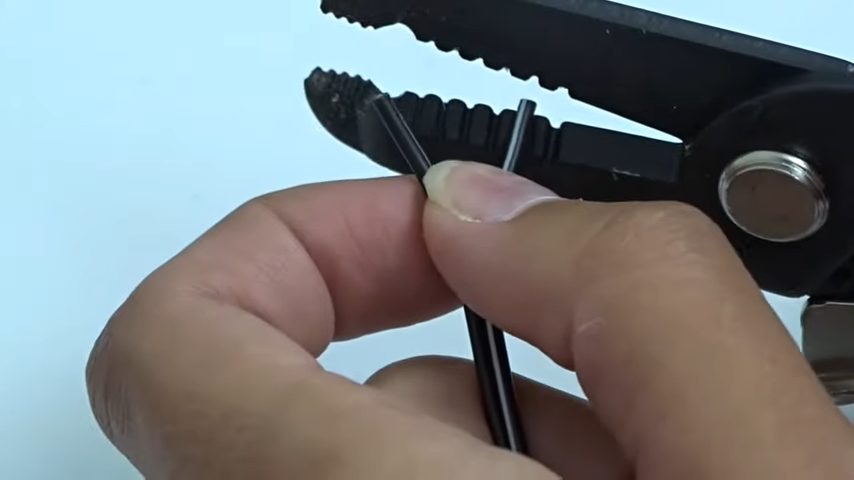 inserting the stripped end of one wire into a crimp