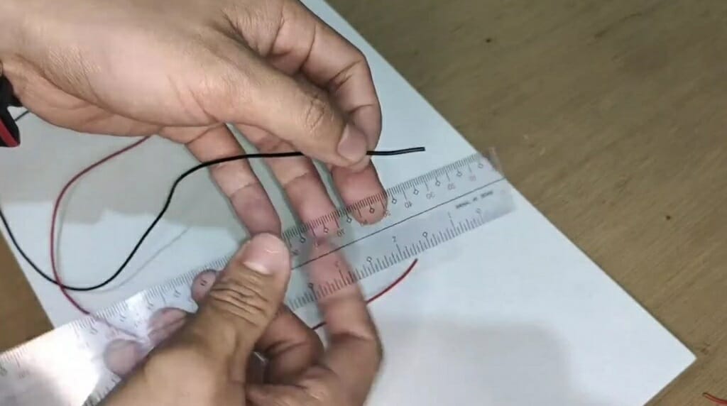 measure black wire with ruler
