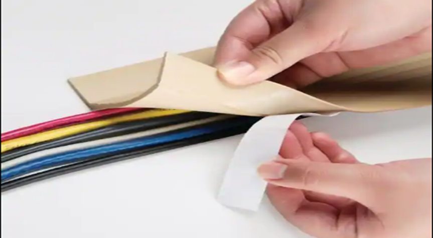peeling the paper off a small part of the vinyl strips