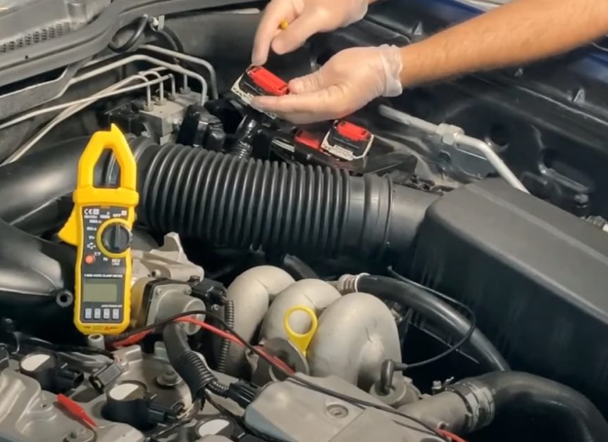 reattaching the ignition coil to the electrical connector