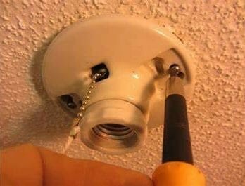 remove the existing pull chain switch from the light fixture