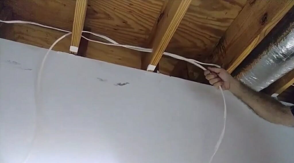 running the wires into the joist ceiling holes