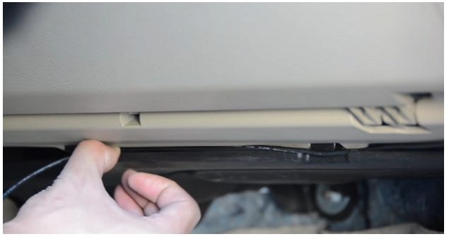tucking the cable underneath your dashboard