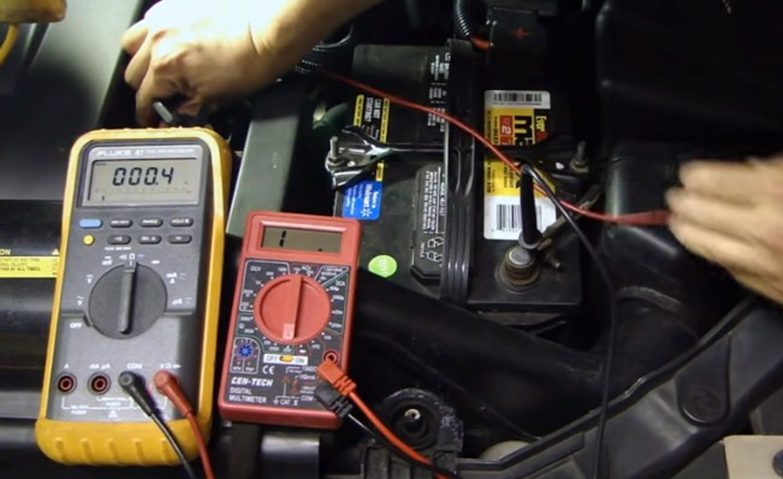 two multimeters, one with 000.4v and the other at 4v
