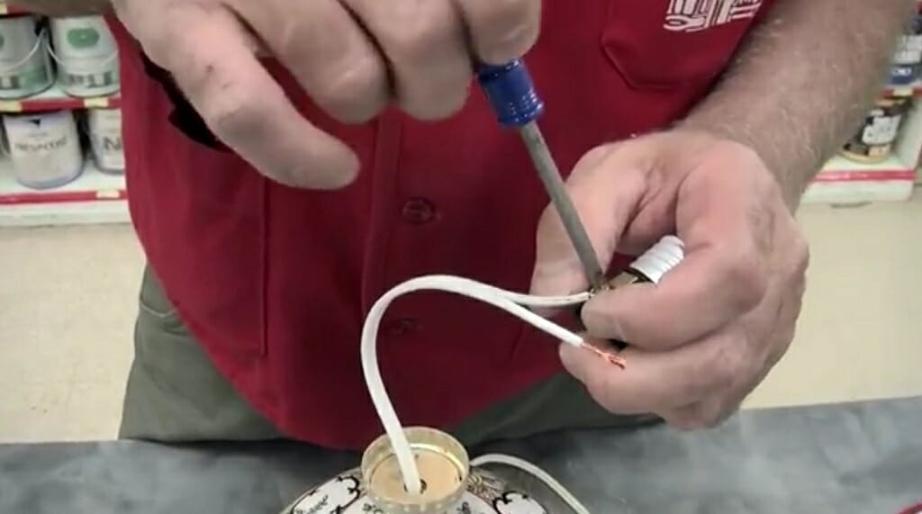 use a screwdriver to tighten the live wire