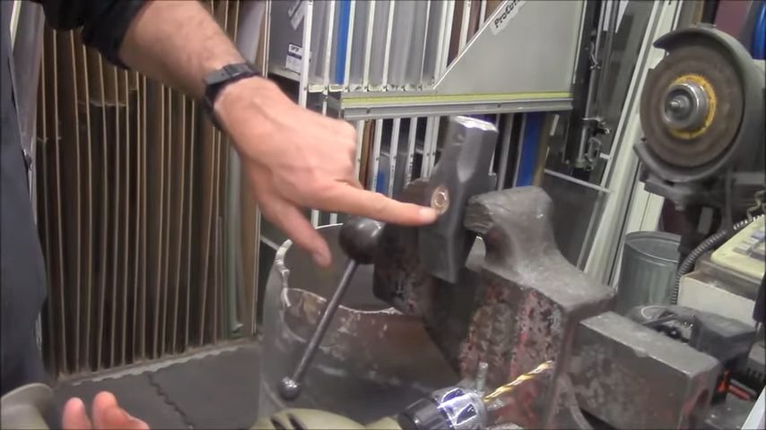 hammer between the jaws of a vise