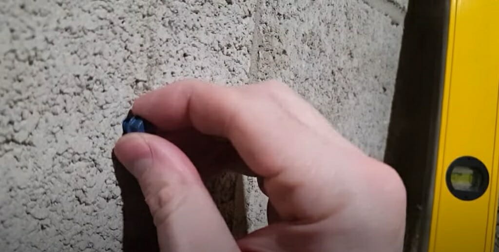 holding the head of tapcon screw on the concrete wall