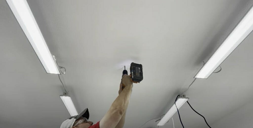 placing the ceiling mount on the ceiling