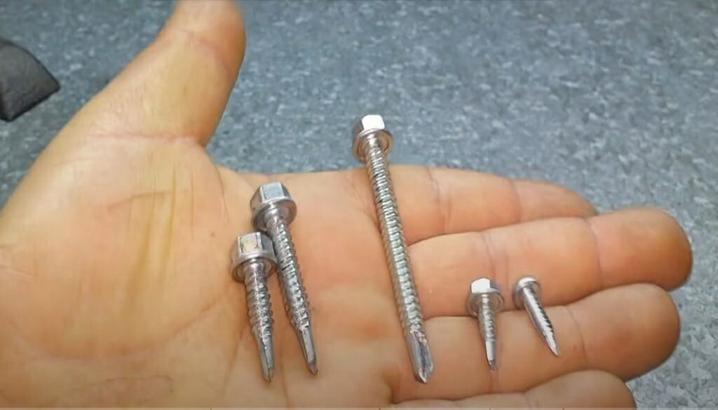 A self-driving screws on a man's palm