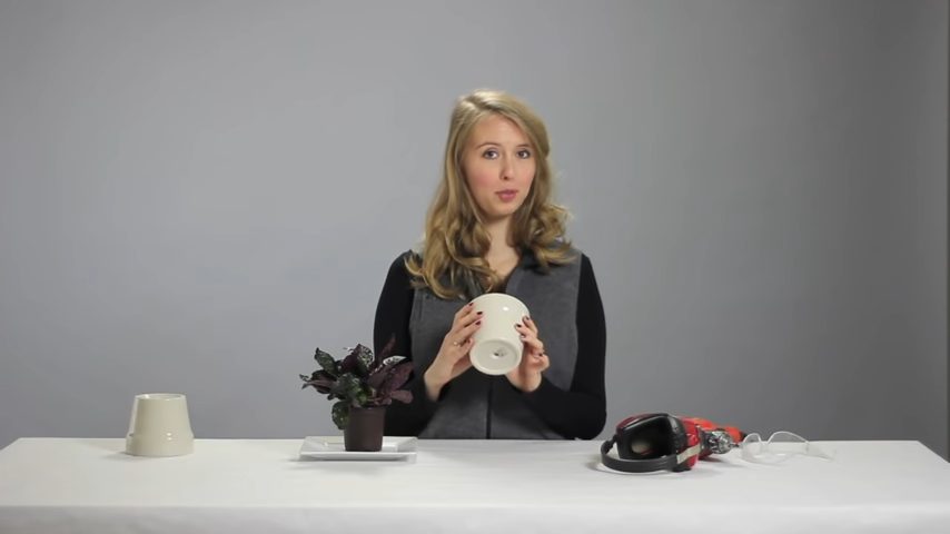 woman holding a ceramic pot