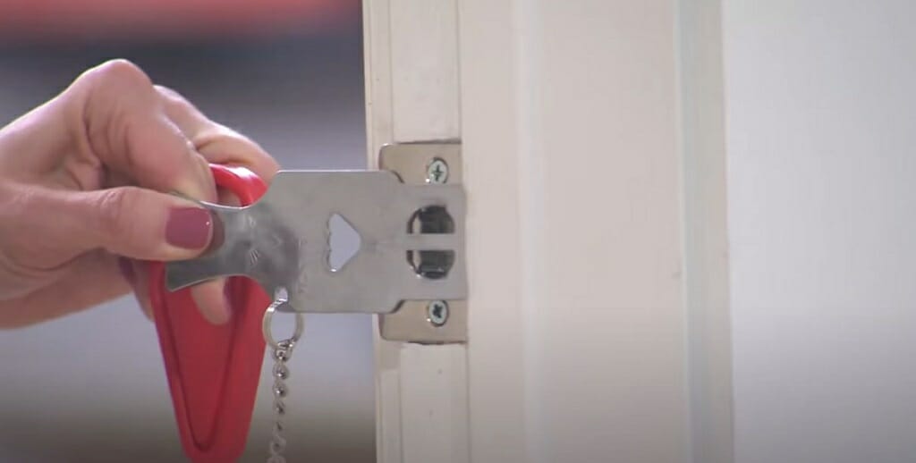 woman using door strike plate locks