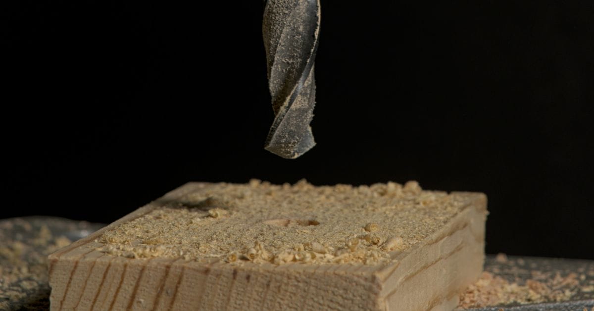 A closer look at a drill bit being drilled on a piece of wood
