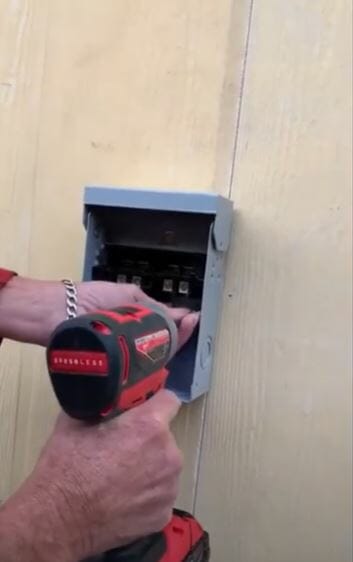 fix the disconnect box to the wall