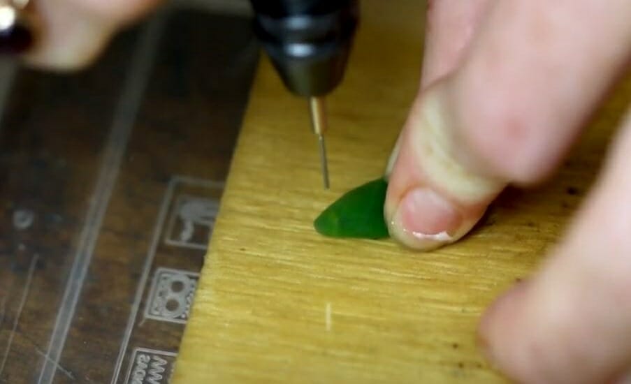 flip the sea glass over and drill again