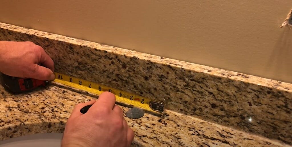 marking location to drill a hole on granite countertop