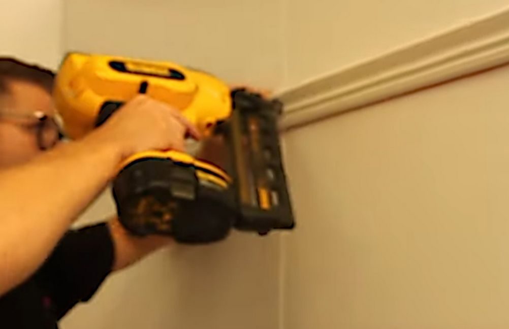 nailing a picture rail to a wall