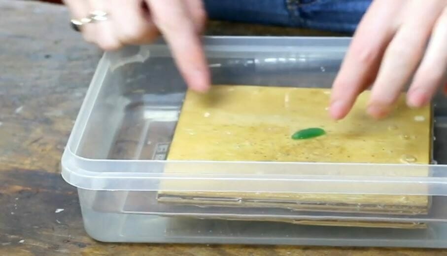 placing the sea glass on the water tray
