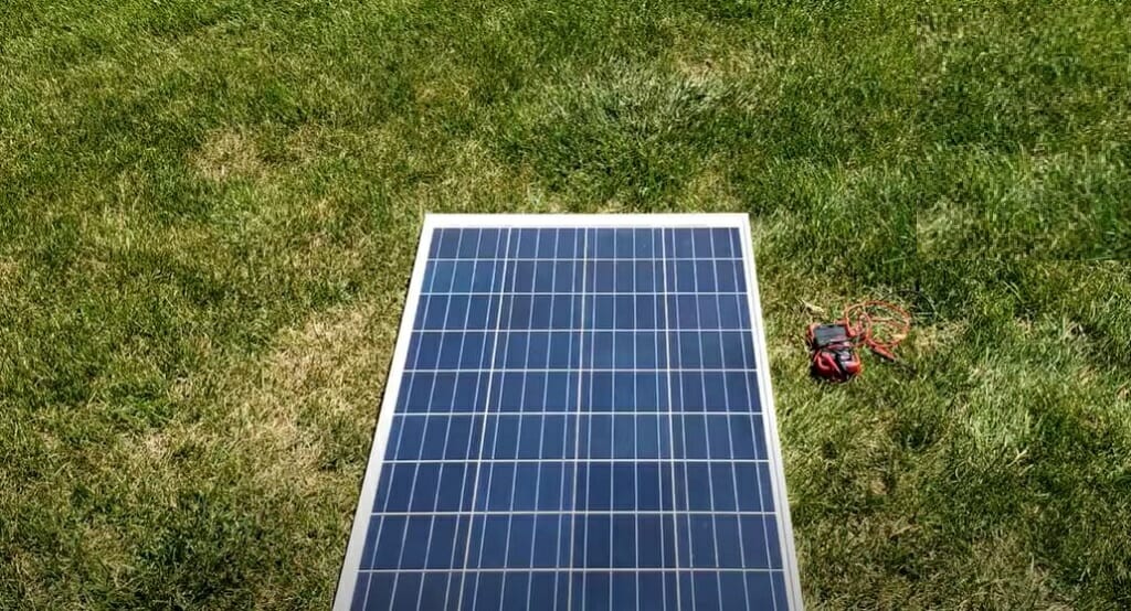 solar panel laid on the green grass