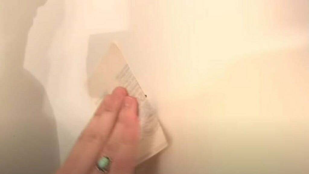 using sandpaper on the wall